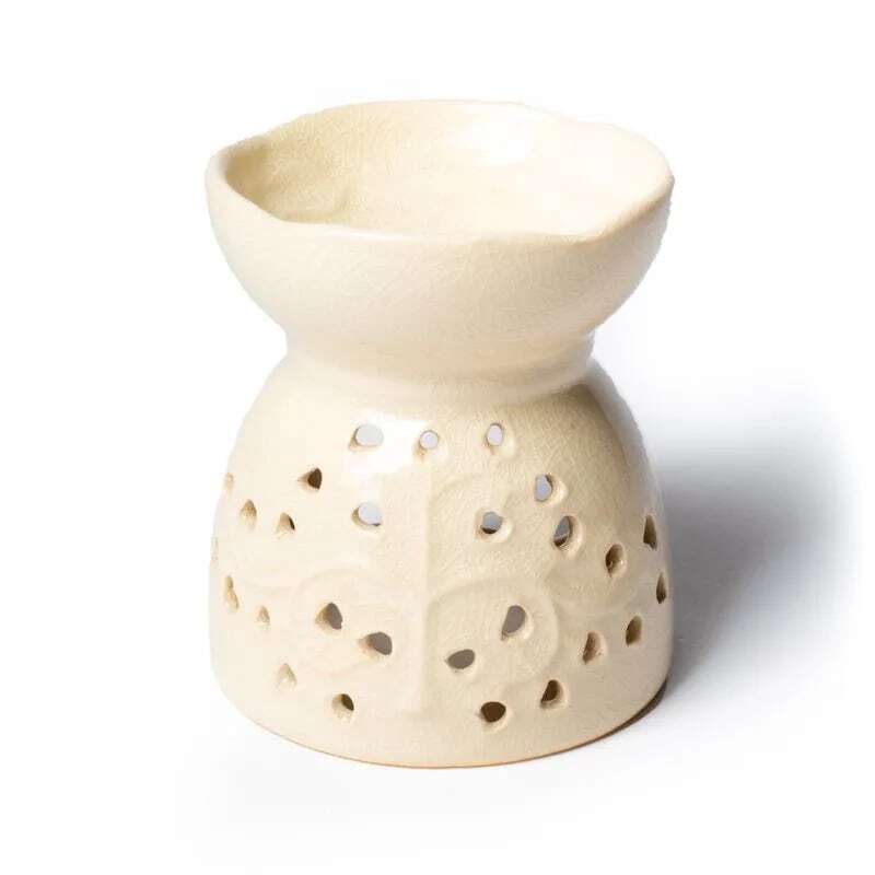 A Бежов маслен дифузер – Дървото на живота ceramic oil heater with holes in it.
