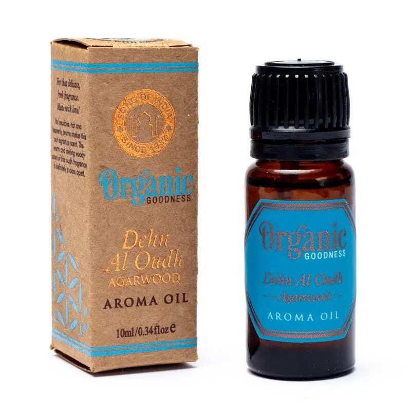 Бутилка Organic Goodness aroma oil - етерично масло от агарово дърво с кутия до него.