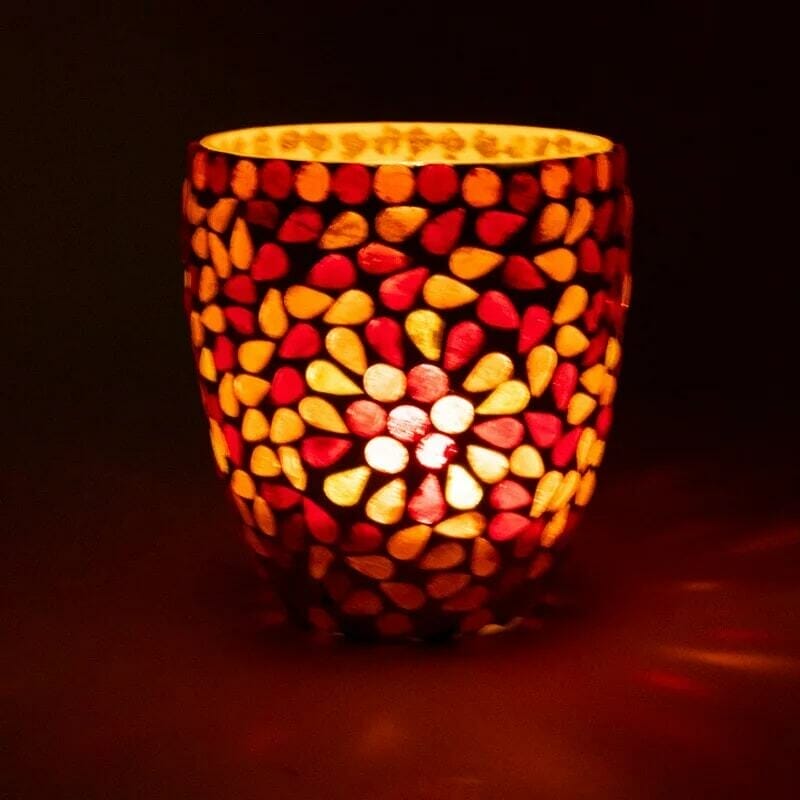 A Мозаечен стъклен свещник - Есен with a red and yellow pattern.