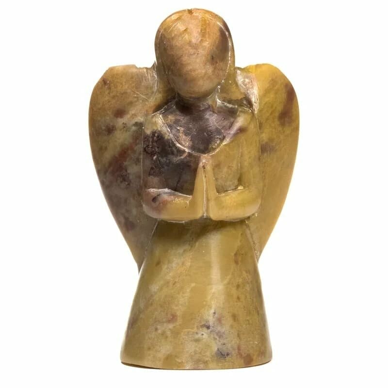 A Статуя Ангел от естествен сапунен камък in a yellow stone.
