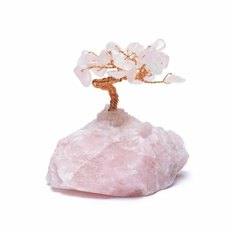 Декоративно от дърво Розов кварц on top of a rock.