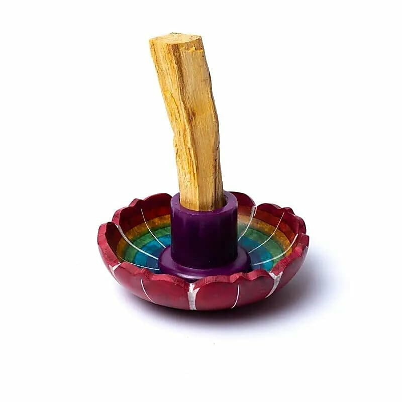 A colorful bowl with a Поставка за изгаряне на Пало санто stick in it.